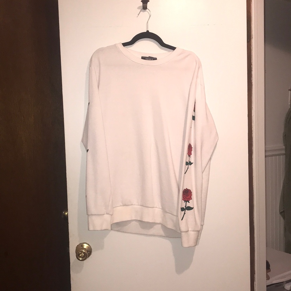 White sweater with roses on sleeves